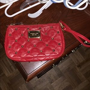 Red Michael Kors clutch with gold studs